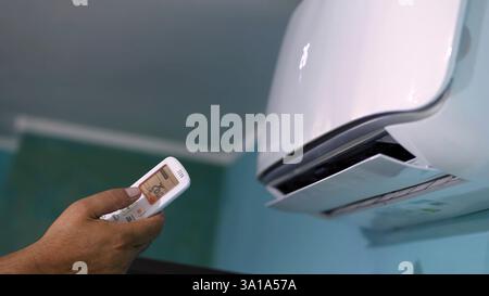Air conditioning ignition with remote control. Stock Photo