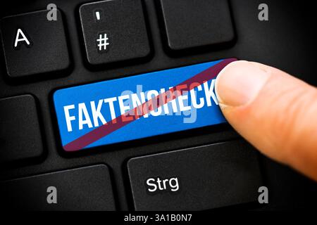 Photomontage, finger on computer key with crossed-out inscription fact check, symbolic photo for the deletion of the fact check on Facebook Stock Photo