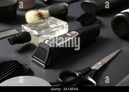 Modern trimmer and shaving accessories on black background Stock Photo
