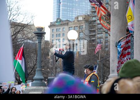 People protesting Donald Trump and Elon Musk at the Boston Commons in ...