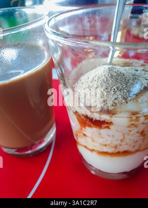 Breakfast food with soft-boiled eggs and vintage coffee Thai style for sale at Thai street food market or Thai vintage style coffee shop restaurant in Stock Photo