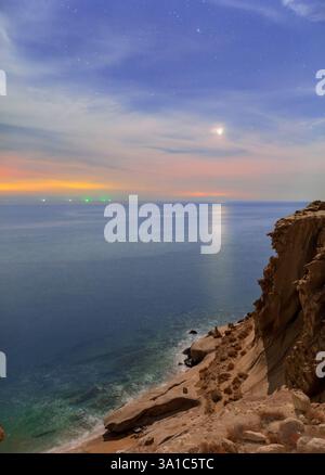 Planet Venus over the Persian Gulf, as seen from a rocky shore in southern Iran. Stock Photo