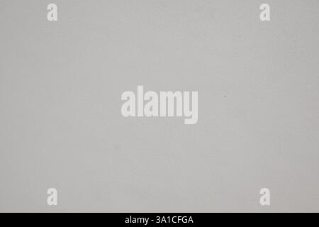 A white background with a few small dots. The background is white and the dots are scattered throughout the image Stock Photo