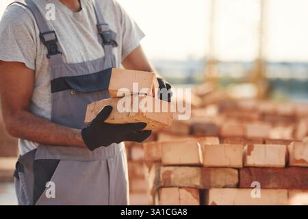 Close up view of man that is working on the construction site. Stock Photo