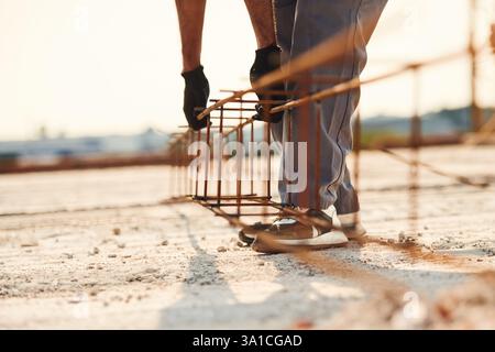 Close up view of man that is working on the construction site. Stock Photo