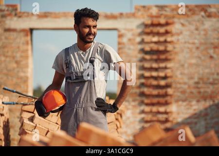 Handsome Indian man is on the construction site. Stock Photo