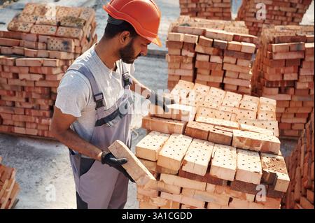 Handsome Indian man is on the construction site. Stock Photo