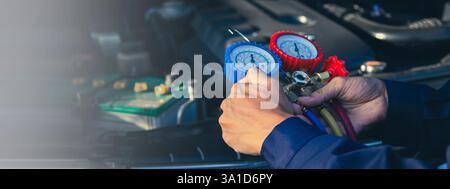 Car air conditioner check service, leak detection, fill refrigerant.Device and meter liquid cooling in the car by specialist technicians. Stock Photo