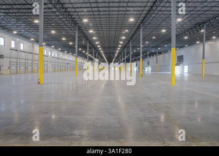 Interior view of large new warehouse building. Stock Photo