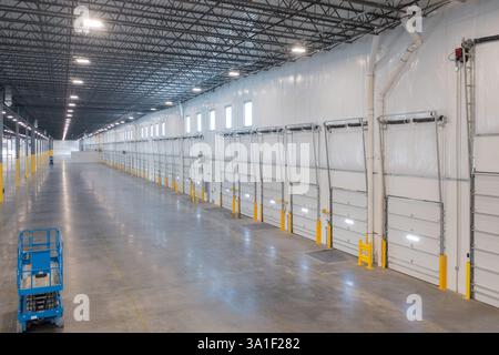Interior view of large warehouse loading docks. Stock Photo