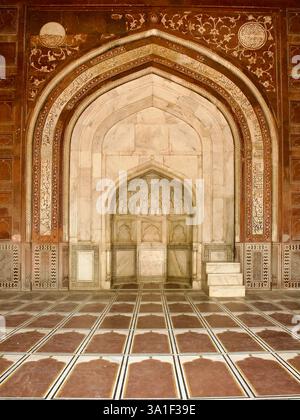 Detail of red sandstone panel with white marble inlay on exterior of ...