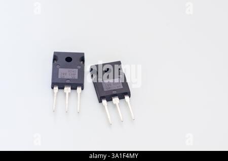Transistor mounted on a breadboard with a white background. Stock Photo