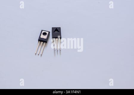 Transistor mounted on a breadboard with a white background. Stock Photo