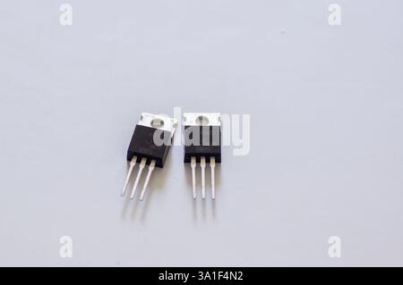 Transistor mounted on a breadboard with a white background. Stock Photo