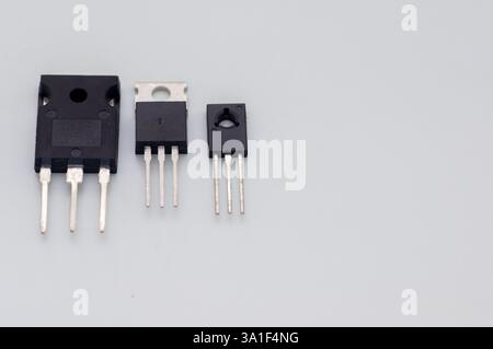 Transistor mounted on a breadboard with a white background. Stock Photo