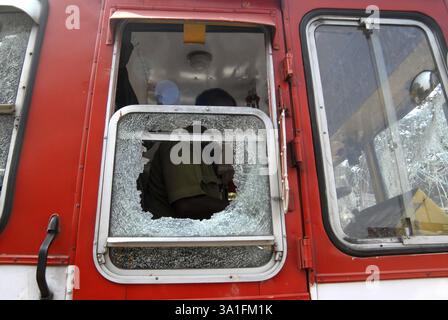 Rioters break and damage the glass pane of a BEST bus after the Dalit community resort to violent protests, Bombay now Mumbai, Maharashtra, India, Asi Stock Photo