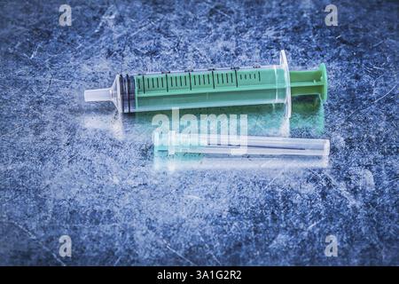 Medical syringe surgical pin on metallic background medicine concept ...