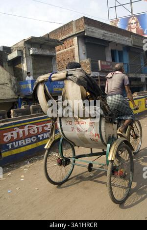 Cycle Rickshaw Rider with Passengers on street at Dhaka, Bangladesh ...