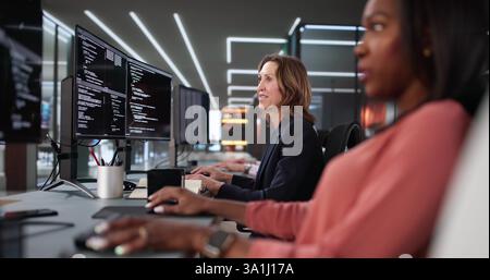 Multiracial Programmers Using Agile Methodology Developing Software in Office Collaboratively Stock Photo