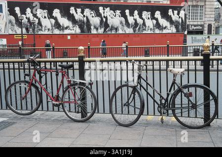 Bicycles at metal bar, London, Britain, UK United Kingdom England Stock Photo