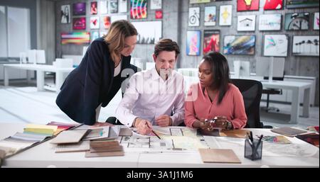 Expert Architects Collaborating on Blueprint for Modern Custom House Remodel. Stock Photo