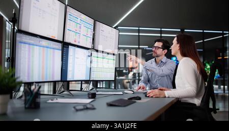 Corporate Accountant Analyzing Tax Invoices on Desktop Computer Screen Stock Photo
