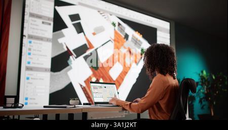 Architect Using 3D Software Analyzing House Floor Plan For Renovation. Stock Photo