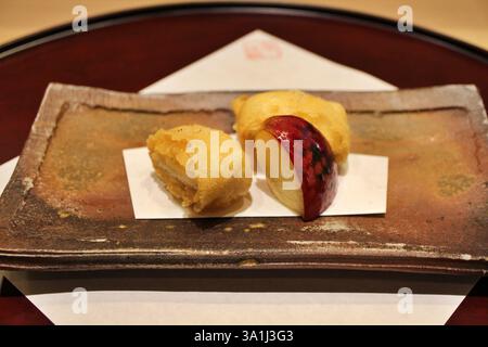 Japanese cuisine: anago (conger eel) tempura with baked apple in Tokyo, Japan Stock Photo