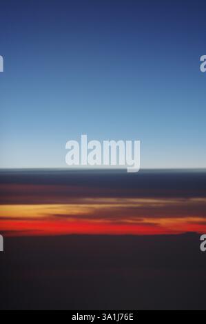Red, Orange, Golden, Black, Gray, Dark blue, morning sky from flight, just before landing Charles de Gaulle, Paris, France, Europe Stock Photo