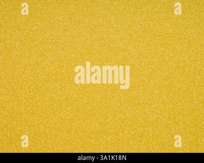 Vibrant yellow tones dance across the textured paper, embodying warmth, energy, and cheerful brightness Stock Photo