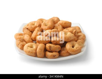 Traditional italian tarallini on ceramic plate isolated on white Stock Photo