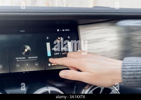 A modern vehicle features an advanced touchscreen dashboard with controls and settings for better user interaction Stock Photo