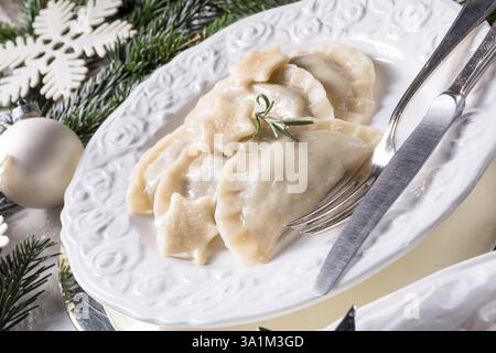Polish style dumplings filled with sauerkraut and mushrooms Stock Photo