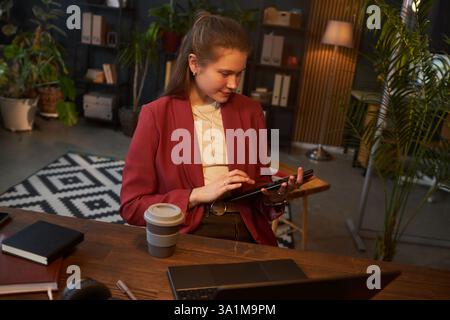 Businesswoman Using Tablet PC At Work Stock Photo