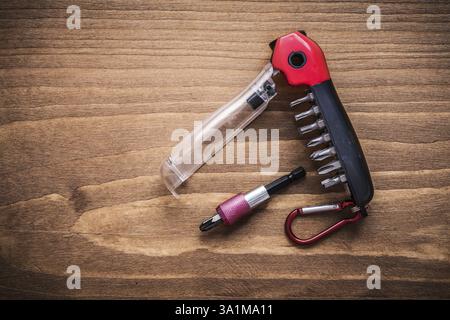 Replaceable turnscrew bits in toolbox on wooden board construction concept Stock Photo