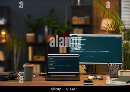 Workplace Of Programmer With Computers In Office Stock Photo