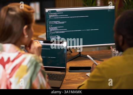 Programmers Working With Security Codes Stock Photo