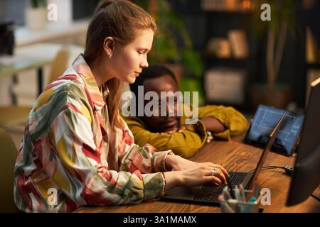 Programmer Working With Metadata On Laptop Stock Photo