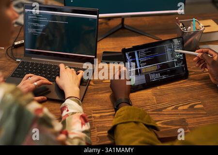 Programmers Discussing Codes For Application Stock Photo