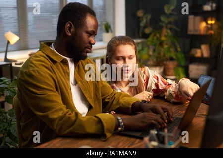 Colleagues Working Over Security Codes Stock Photo