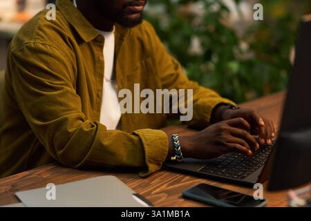 Manager Typing On Laptop At Workplace Stock Photo