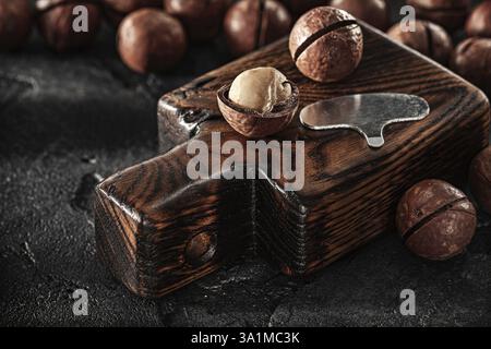 Opened Nuts Of Macadamia On Little Vintage Chopping Board Stock Photo