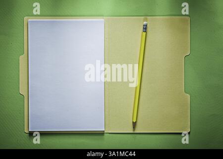 Office folder blank paper sheets pencil on green background Stock Photo