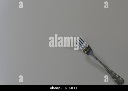 Single fork on the table. Stock Photo
