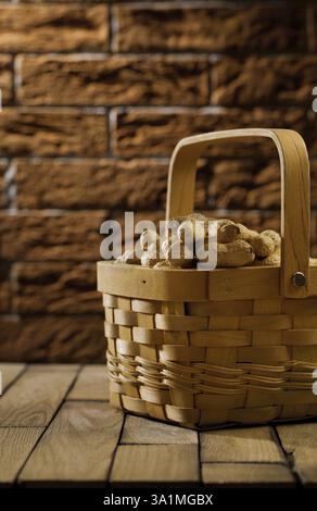 Peanuts in wooden basket Stock Photo