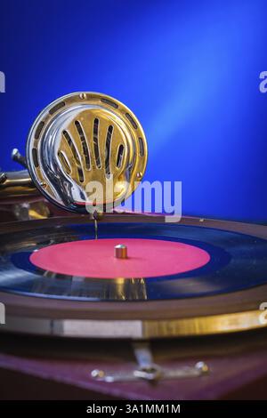 Old gramophone on blue background very close up Stock Photo