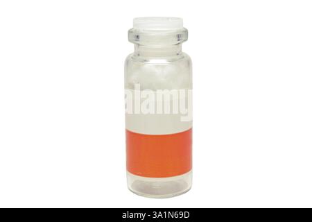 glass medicine bottle with two-color label, plastic lapped stopper, empty, with cotton absorbent inside Stock Photo