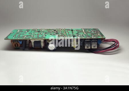 switch mode power supply internal module of LCD TV, without case, electronic components, back view Stock Photo
