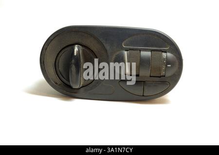 headlight position control module with headlight leveler and dashboard brightness level control wheels, isolated on white background Stock Photo