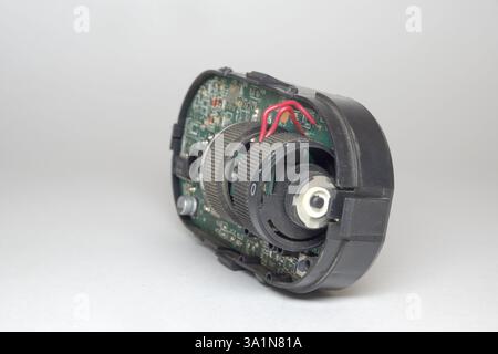 car headlight position control module inner electronic parts, leveler and brightness wheel on main board Stock Photo